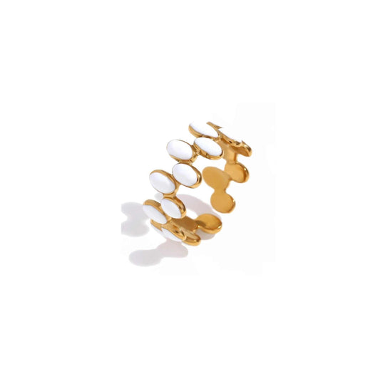 White speckled band ring with playful enamel accents.