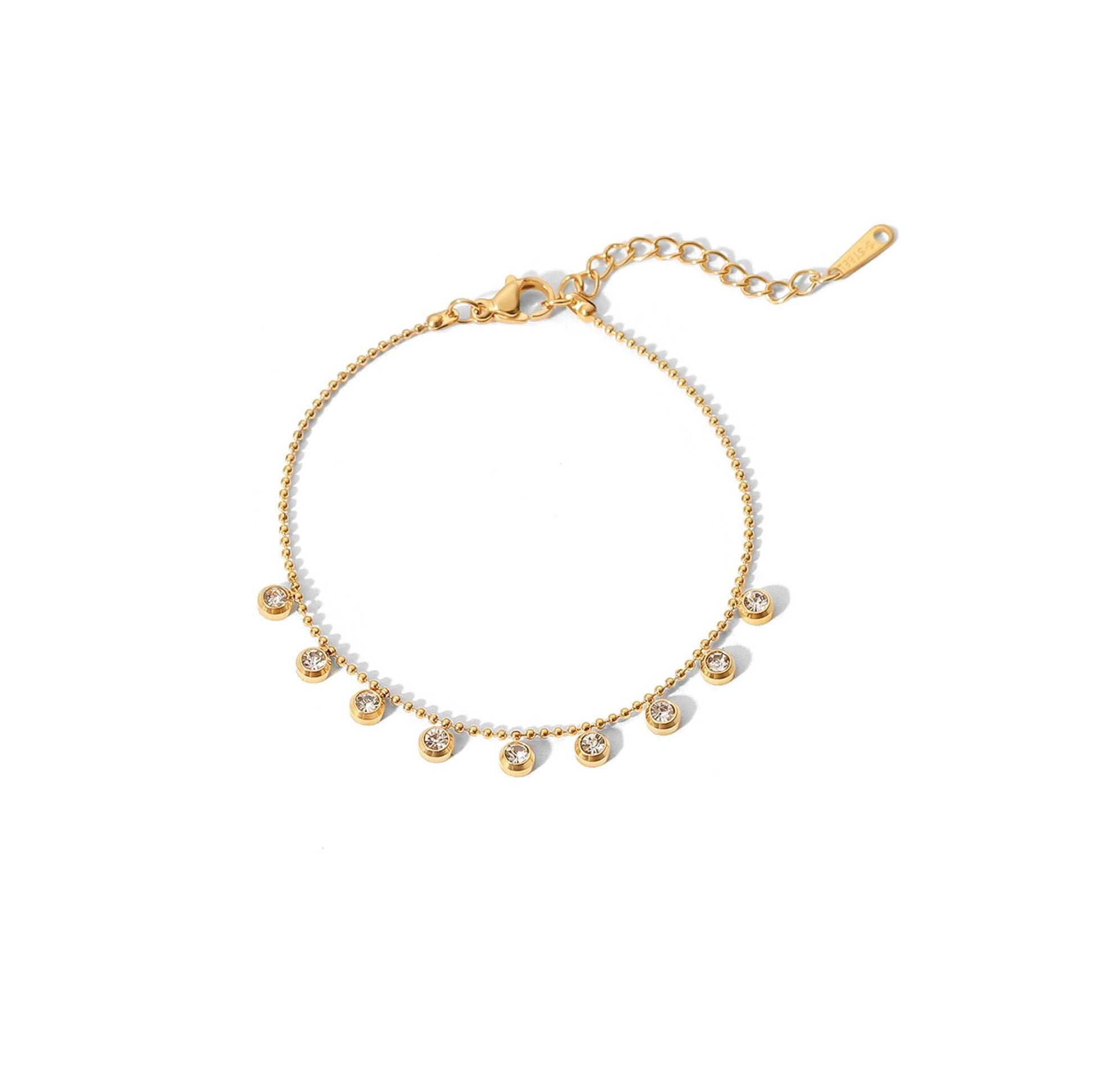 Gold beaded station bracelet with shimmering zircon stones, chain length 17cm, extender 5cm.