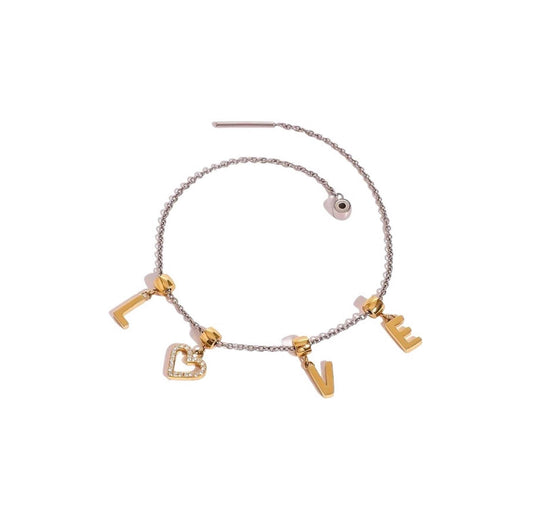 Mixed metal cable chain bracelet with sliding "L.O.V.E" charms and threaded closure.