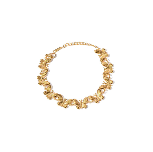 Gold butterfly bracelet with delicate butterfly charm design, 16.5cm chain length with 4cm extender.