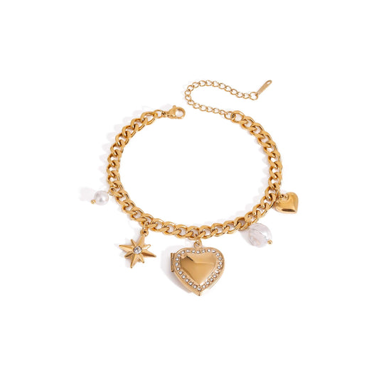 Gold North Star Heart Charm Bracelet with celestial and heart charms.
