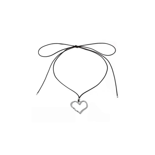 Silver heart pendant cord necklace with 149cm cord length and 3.95cm pendant.