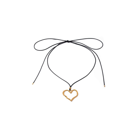 Gold heart pendant cord necklace with black cord and molten heart design.