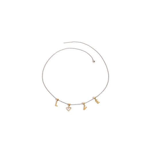 Mixed metal cable chain necklace with sliding "LOVE" charms and threaded closure.