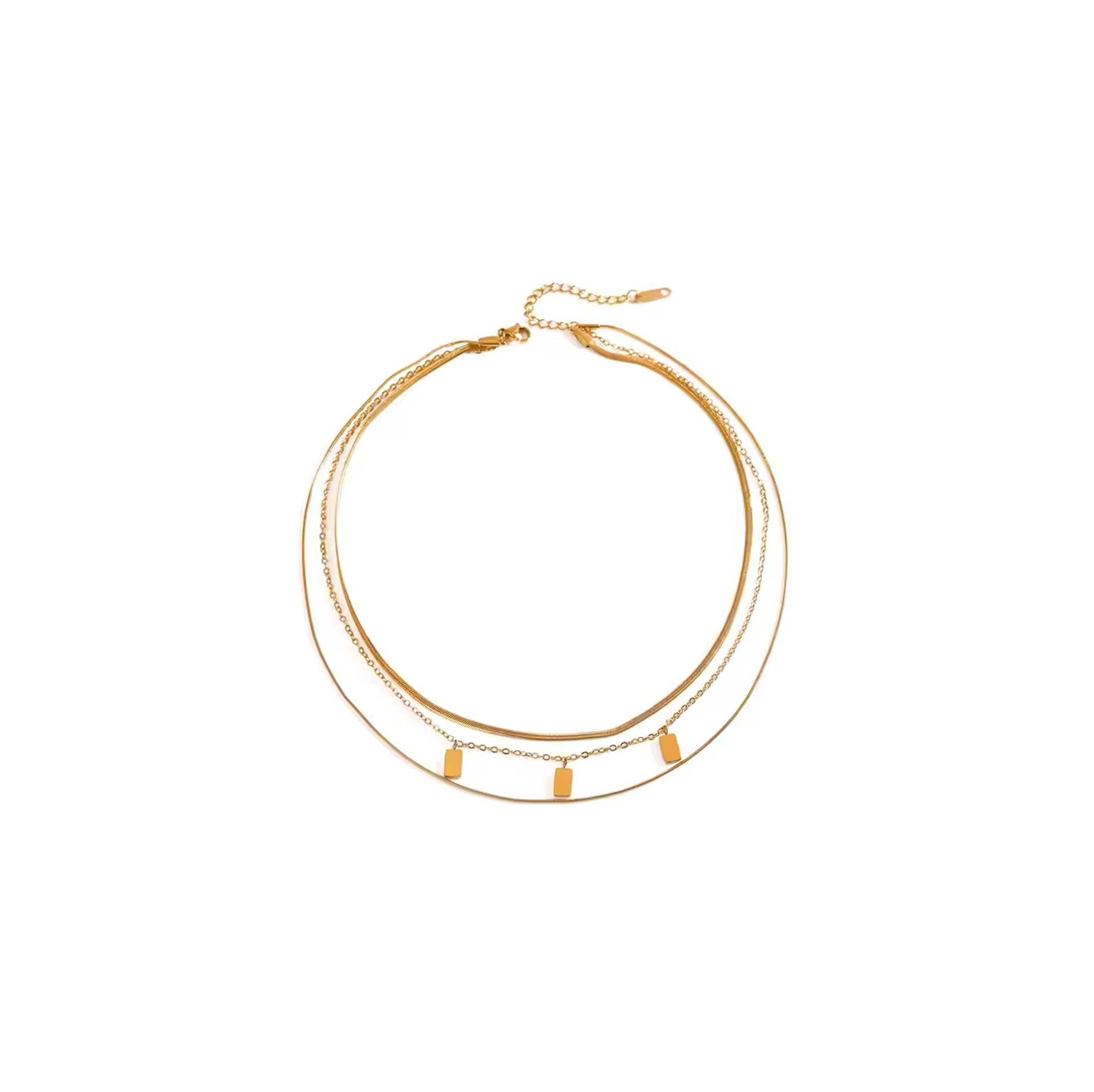 Gold mini tablet multi chain necklace with snake chains and tablet charms.