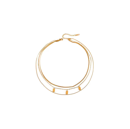 Gold mini tablet multi chain necklace with snake chains and tablet charms.