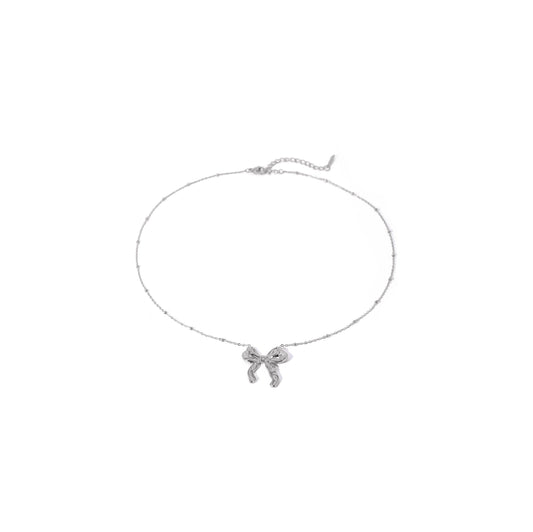 Silver bow ball chain necklace with delicate bow design and trendy ball chain.