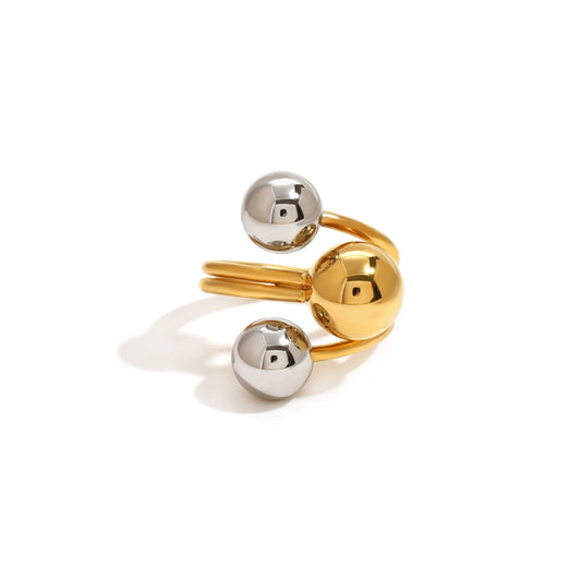 Adjustable mixed metal ball ring with unique statement design.