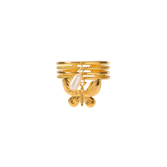 Gold butterfly charm ring with adjustable band for stacking.