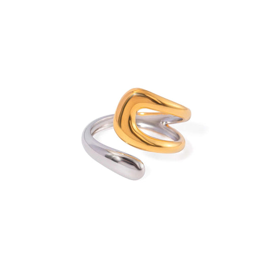 Mixed metal asymmetric ring with a playful swirl design.